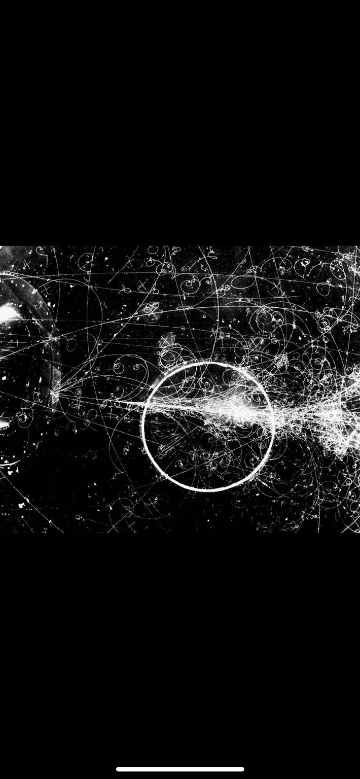 Black-and-white particle tracks with curved paths and intersecting spirals
